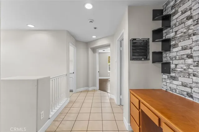 a view of a kitchen with white cabinets