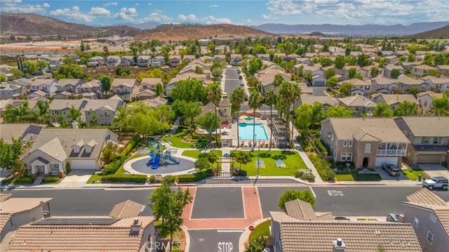an aerial view of a house with a swimming pool