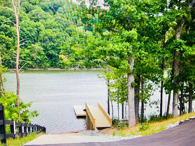 a view of a bench in a backyard of house