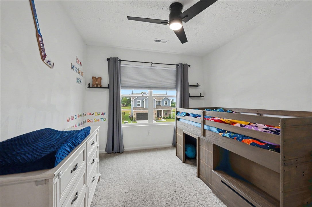 3011 Falls Road Clayton, OH 45315 - Photo 46 of 66 A cheerful room with plush carpeting and a large window overlooking the neighborhood offers a comforting personal haven.