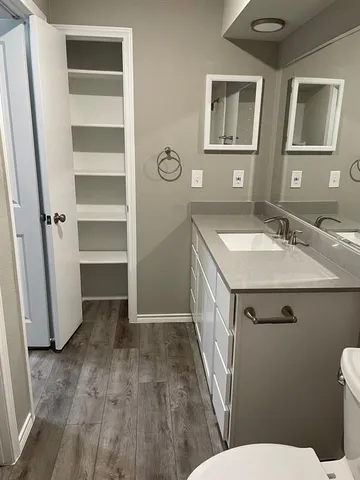 a bathroom with a sink toilet and vanity