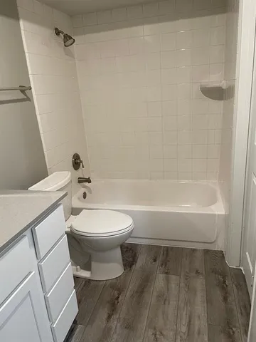 a bathroom with a toilet a sink and a shower