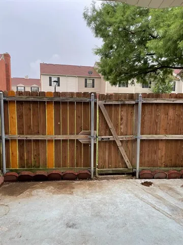 a view of a park with large trees