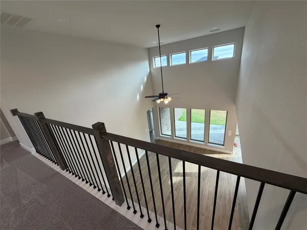 a view of a hallway with windows