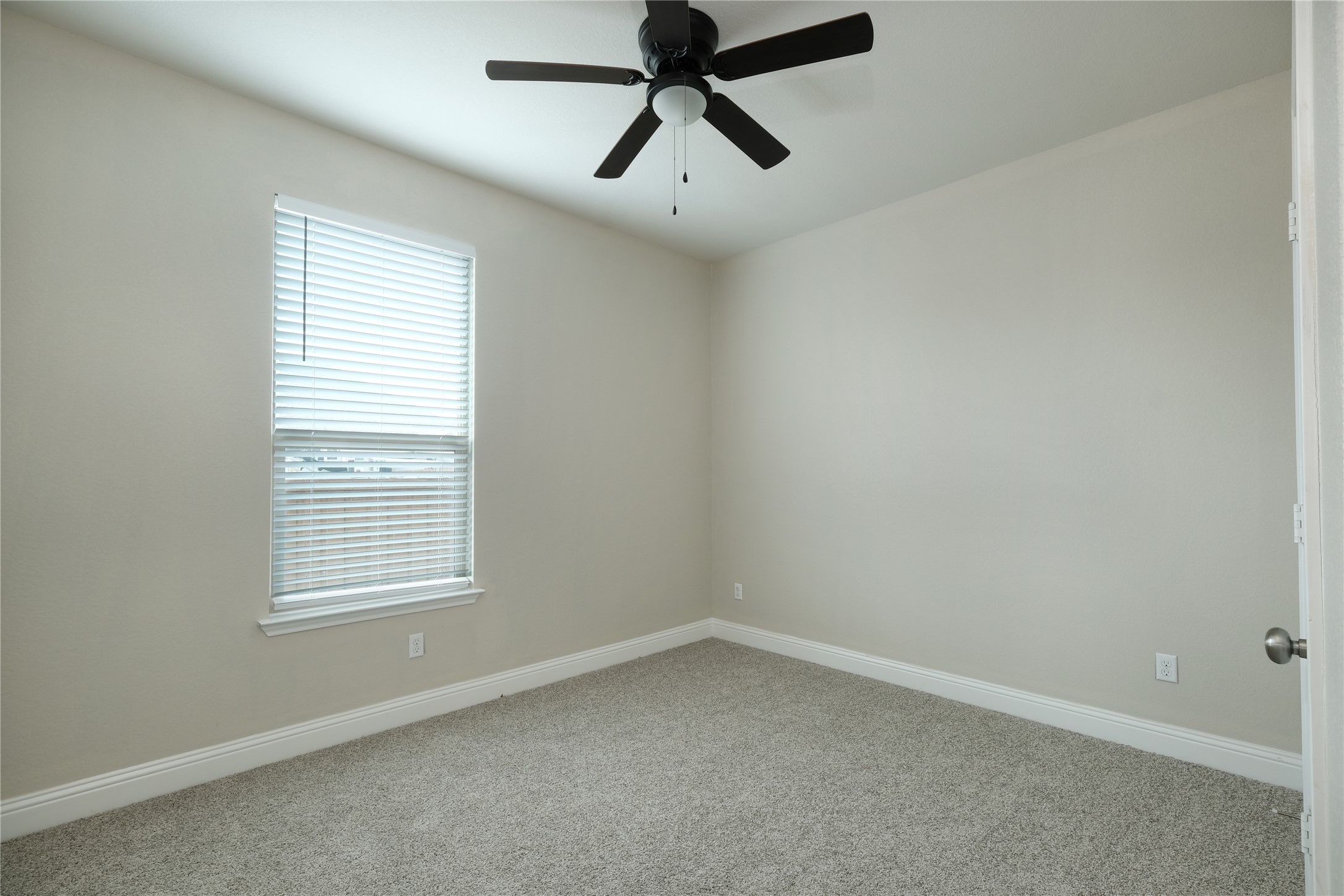 1804 Elaina Loop Leander, TX 78641 - Photo 6 of 12 Empty room featuring light colored carpet and a ceiling fan