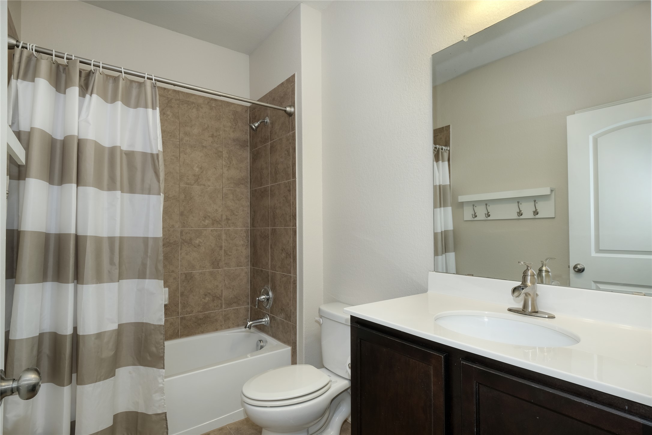 1804 Elaina Loop Leander, TX 78641 - Photo 7 of 12 Bathroom with shower / bath combo and vanity