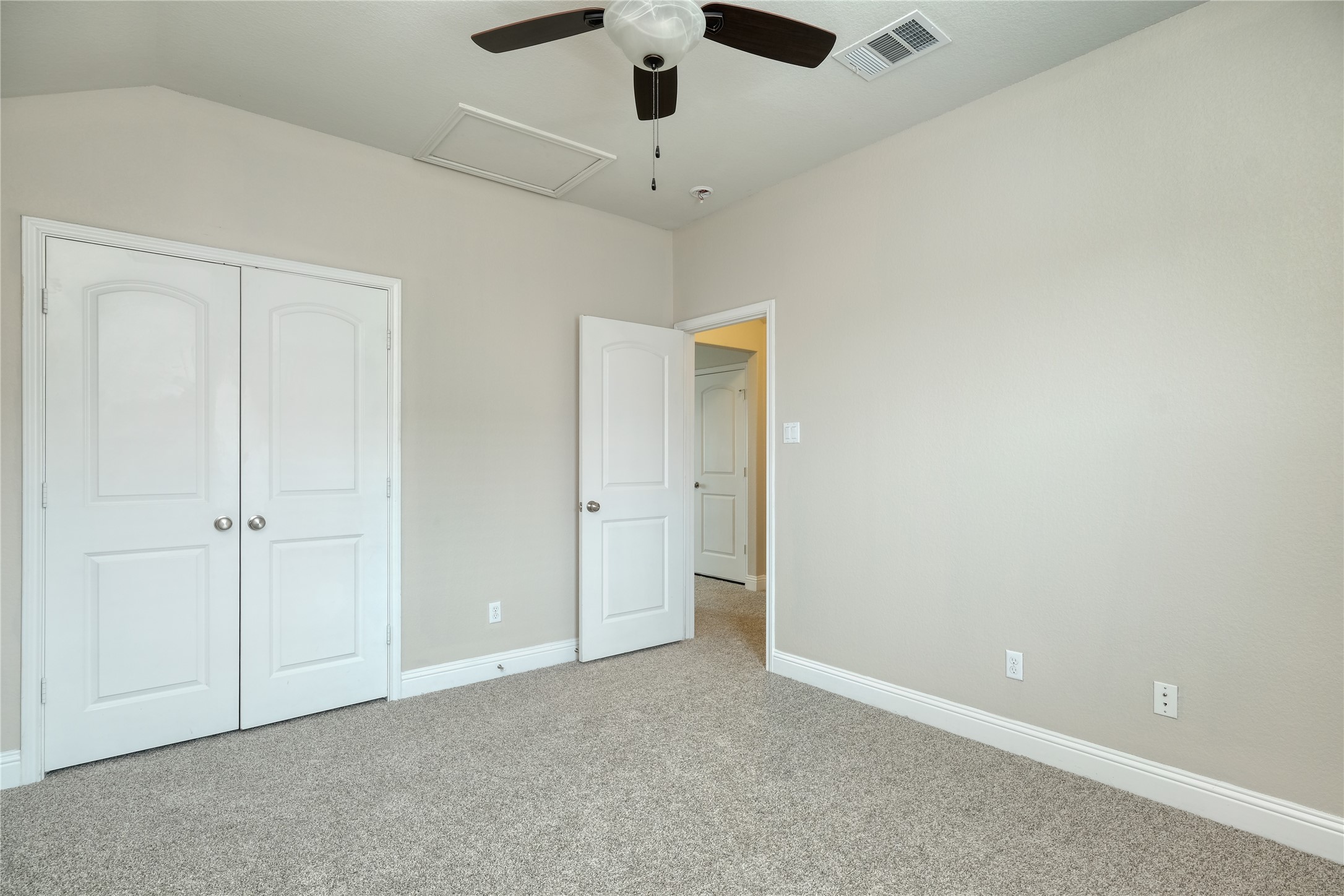 1804 Elaina Loop Leander, TX 78641 - Photo 10 of 12 Unfurnished bedroom with carpet floors, ceiling fan, and a closet