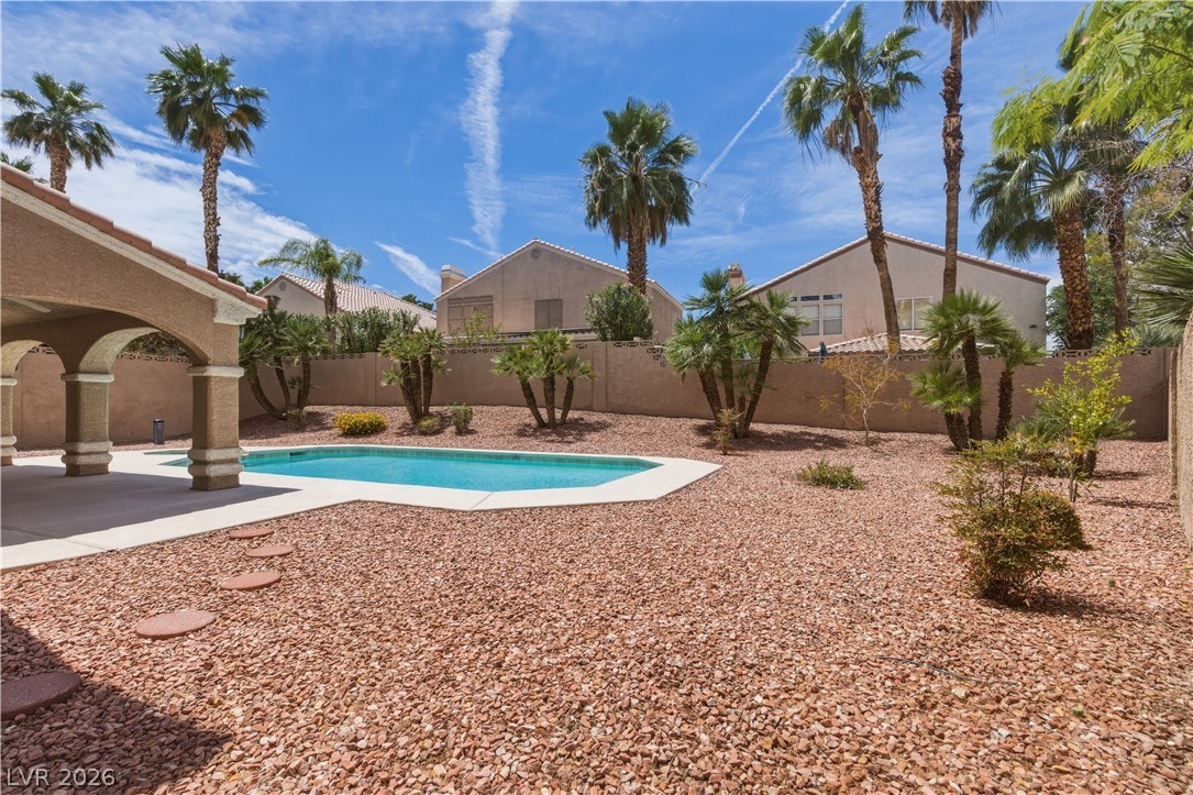 29 Olive Tree Henderson, NV 89074 - Photo 57 of 60 This spacious yard features a private pool, perfect for outdoor enjoyment and relaxation.