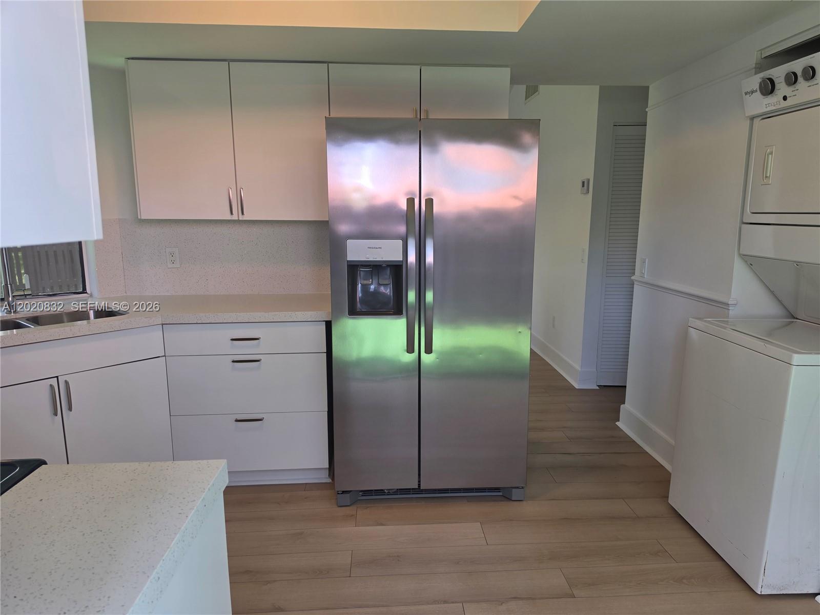 15240 Southwest 45th Terrace, Unit 54F Miami, FL 33185 - Photo 22 of 48 a room with a refrigerator