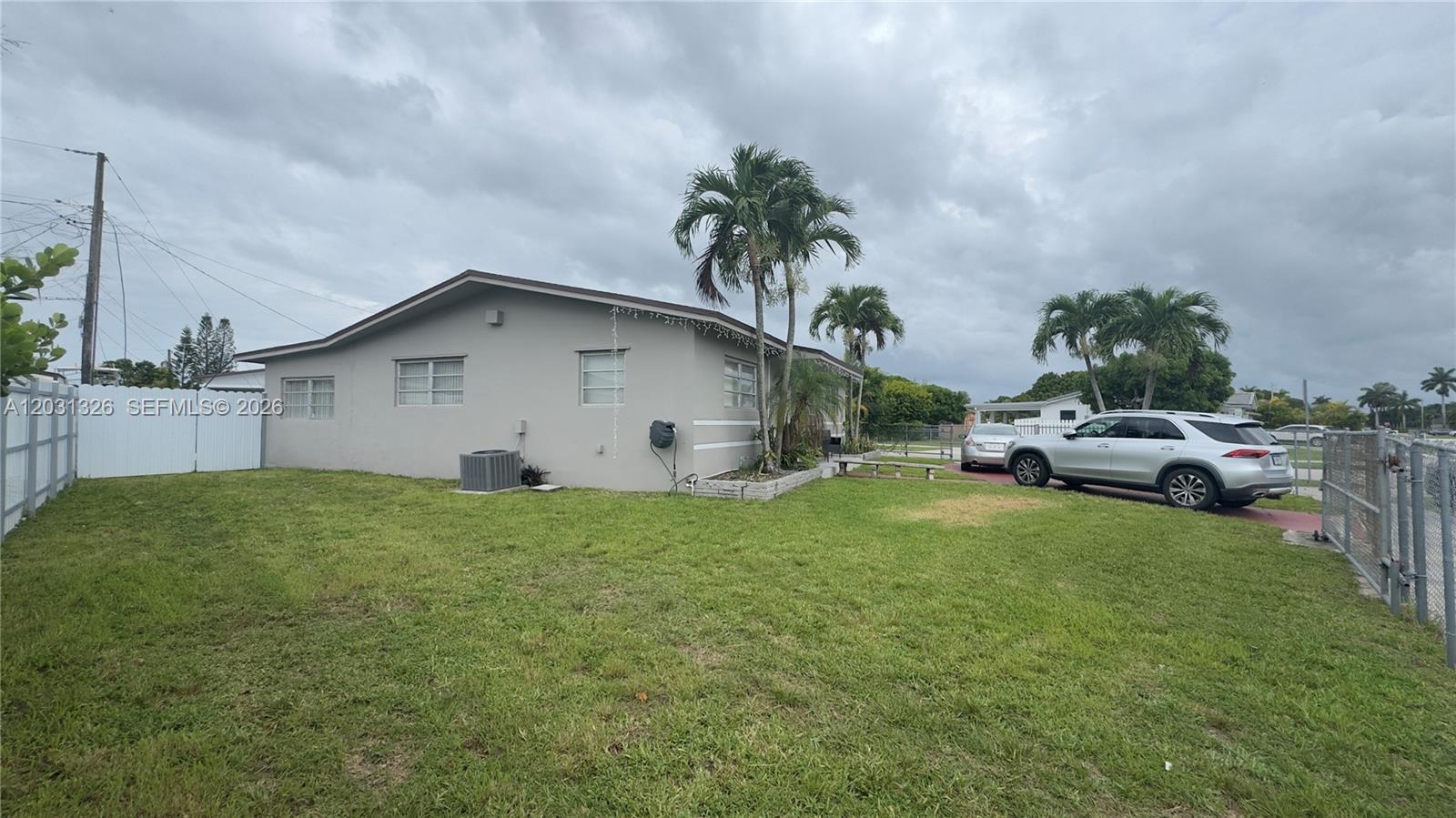 12480 Southwest 189th Street Miami, FL 33177 - Photo 24 of 25 a house view with a garden space