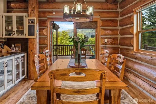 a view of a dining room with balcony and furniture