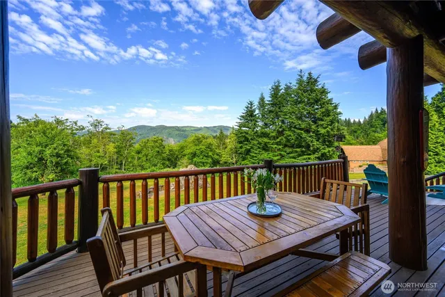 a view of a table and chairs on the roof deck