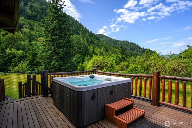 a view of a balcony with wooden floor and outdoor space