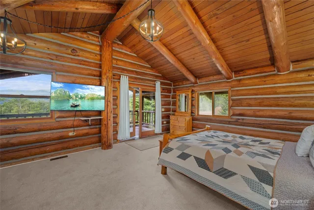 a view of a room with furniture and windows