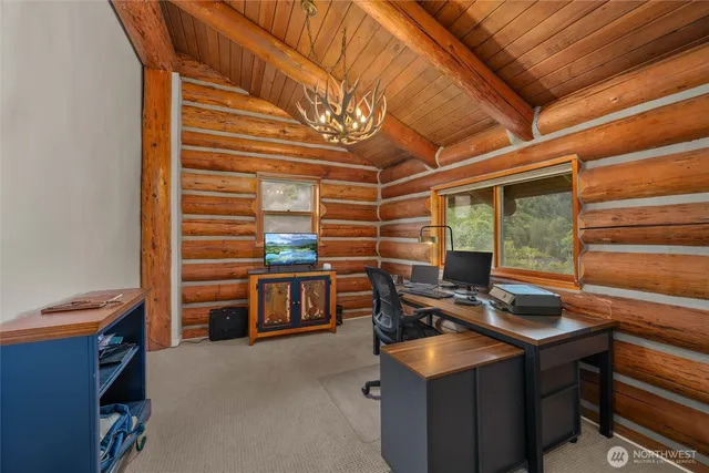 a bathroom with a granite countertop sink a mirror and shower