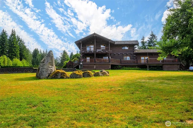 a view of a lake with a house in the background