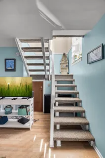 a view of living room with furniture and a window