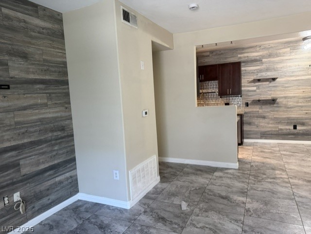 3318 North Decatur Boulevard, Unit 1163 Las Vegas, NV 89130 - Photo 10 of 35 Stylish tile flooring and contemporary wood-look accent walls define this versatile living space.