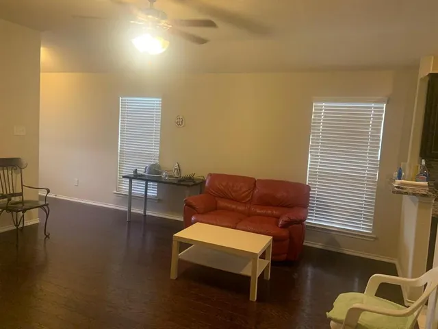 a view of a dining room with furniture and window