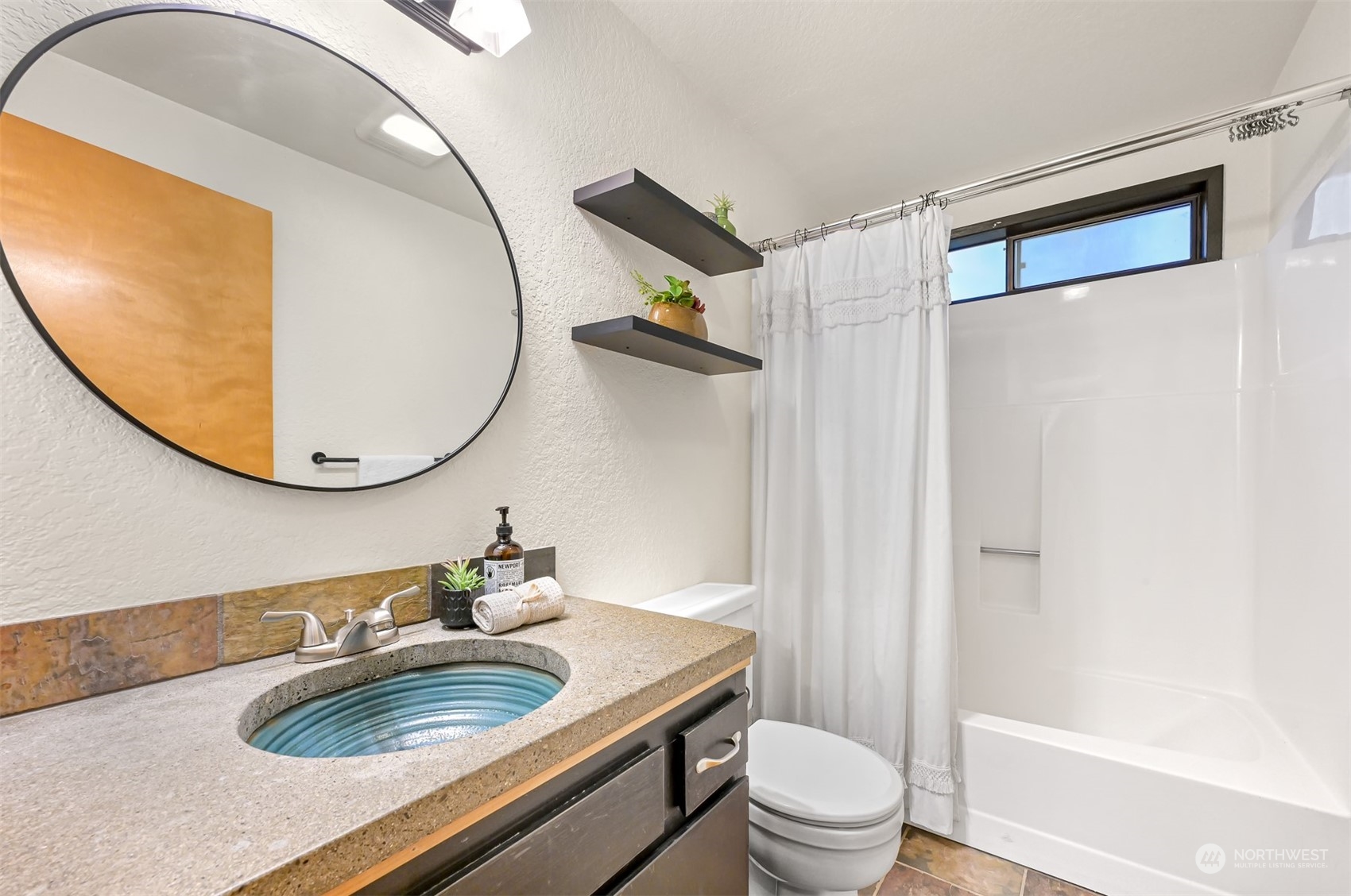 1506 Willowbrook Place Bellingham, WA 98229 - Photo 11 of 37 a bathroom with a sink a toilet and a mirror