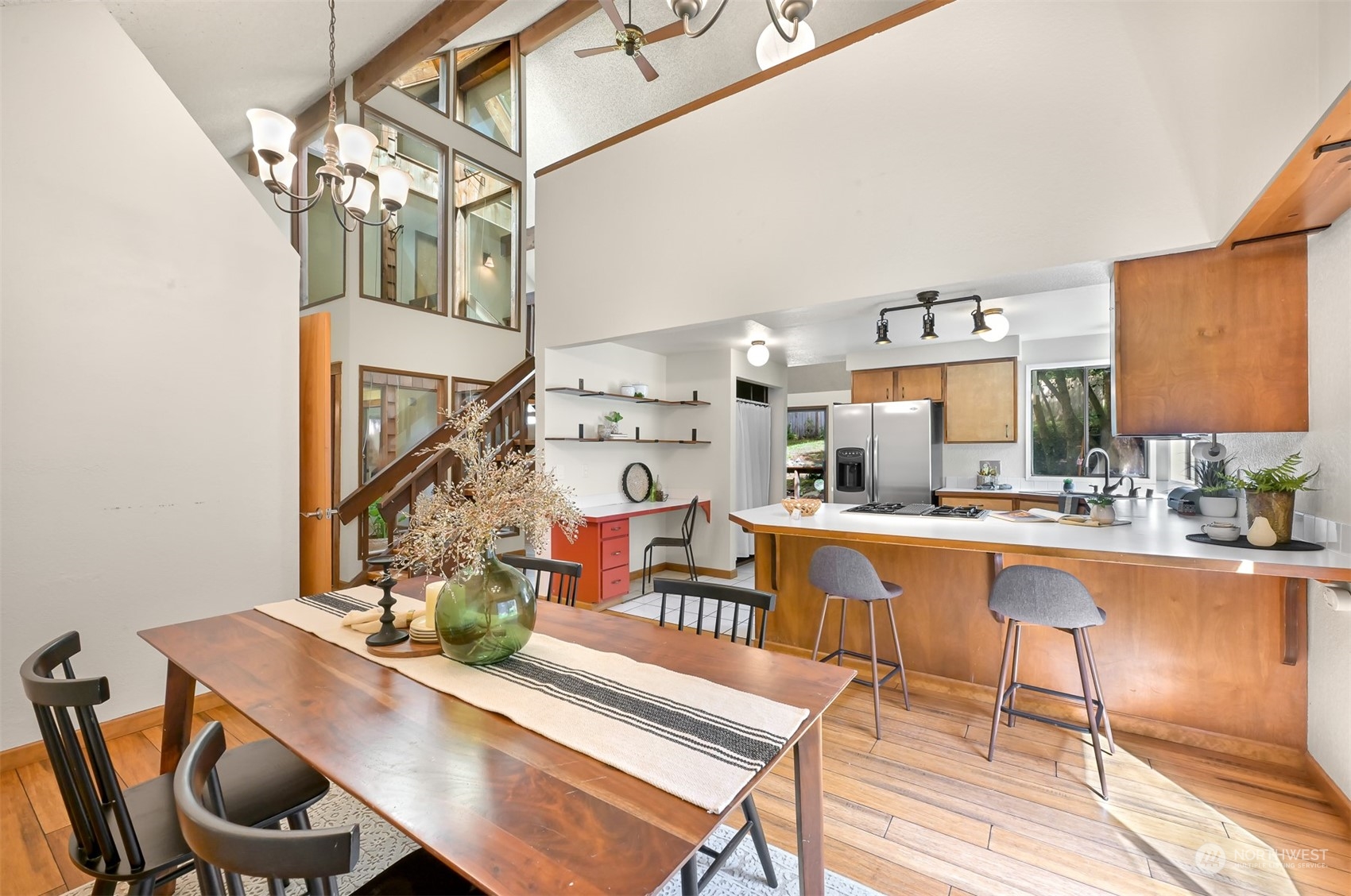 1506 Willowbrook Place Bellingham, WA 98229 - Photo 20 of 37 a dining room with furniture a chandelier and wooden floor