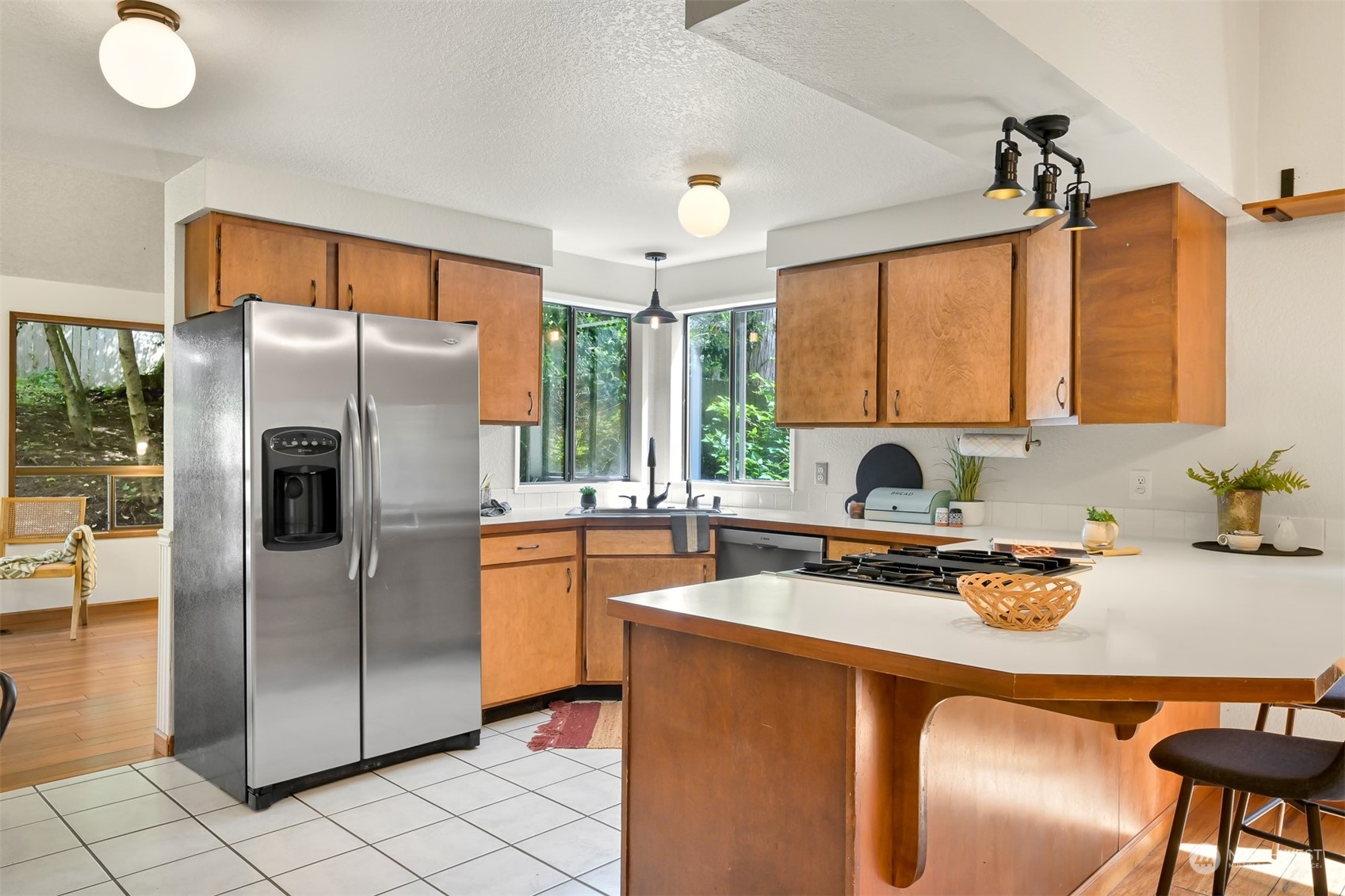 1506 Willowbrook Place Bellingham, WA 98229 - Photo 23 of 37 a kitchen with stainless steel appliances granite countertop a refrigerator a sink a stove and island