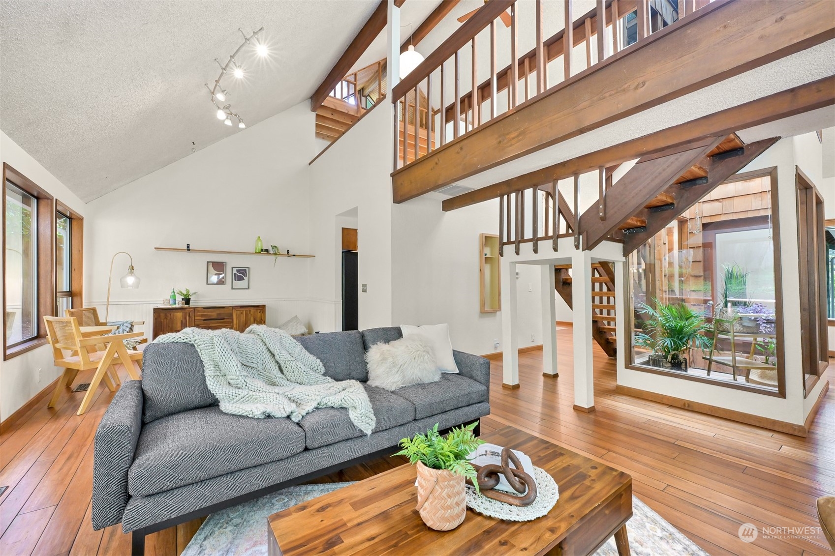 1506 Willowbrook Place Bellingham, WA 98229 - Photo 26 of 37 a living room with furniture and a large window