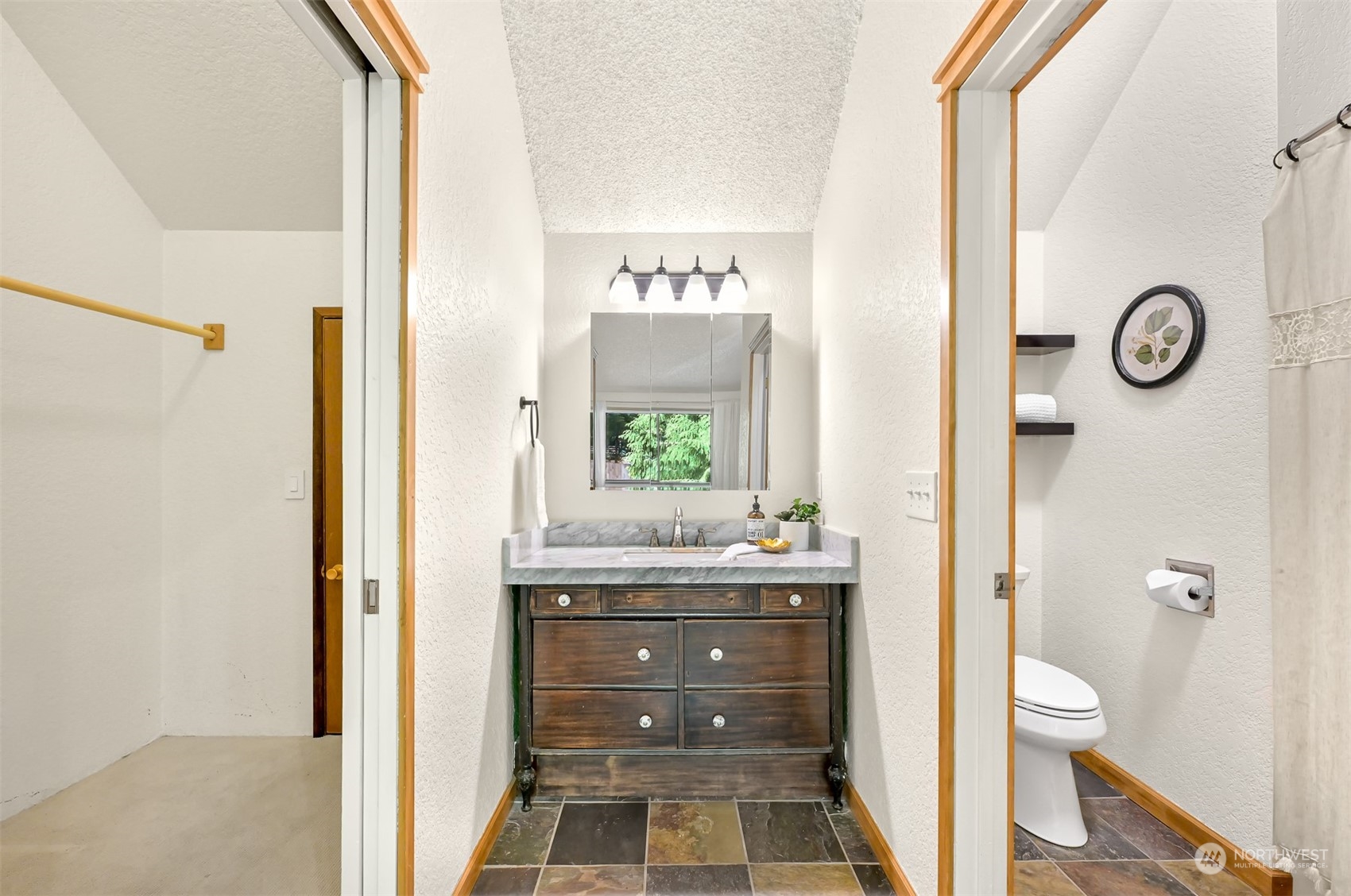 1506 Willowbrook Place Bellingham, WA 98229 - Photo 7 of 37 a bathroom with a granite countertop sink toilet and shower