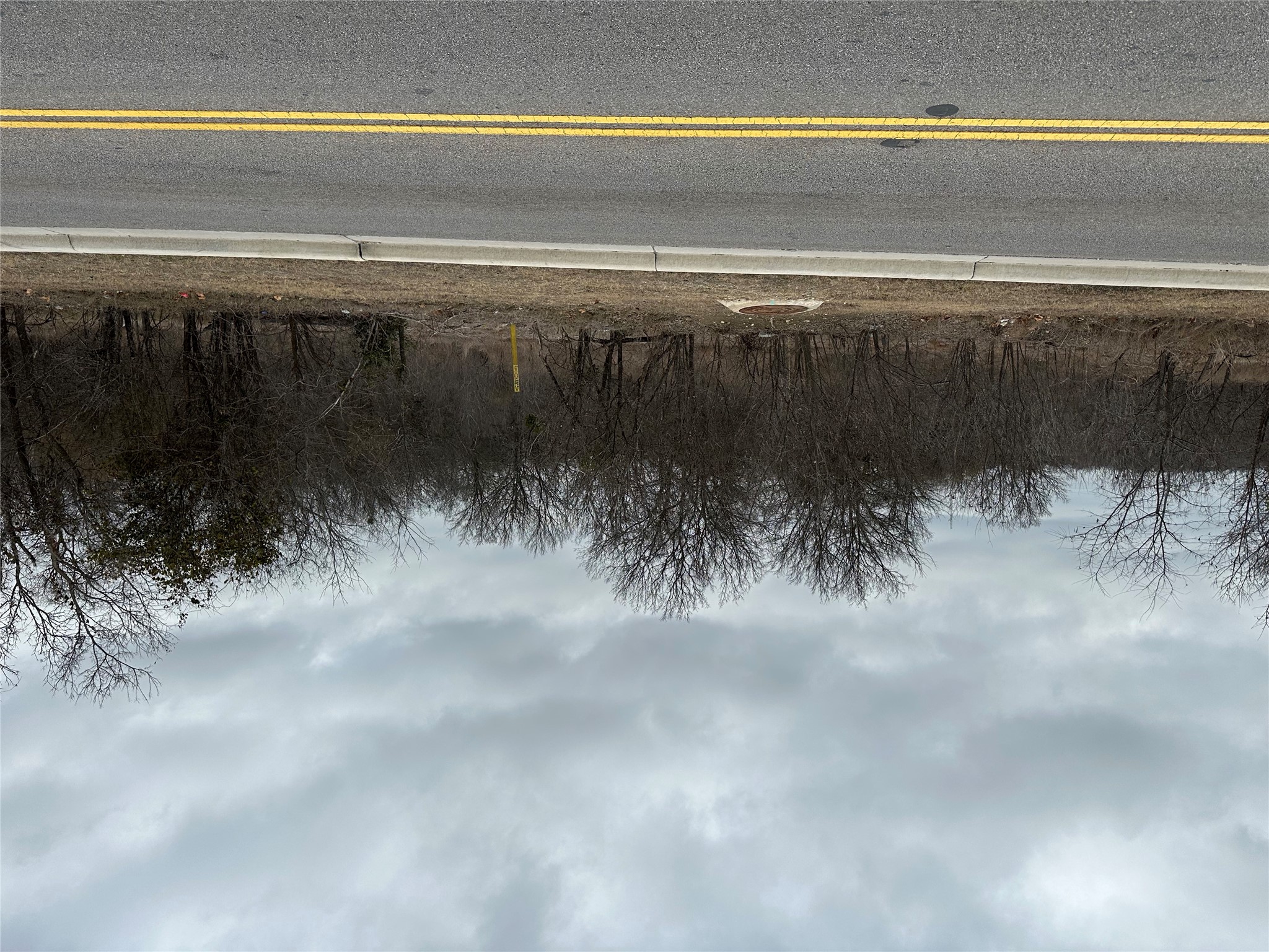 3 Lehman Road Kyle, TX 78640 - Photo 6 of 12 View of asphalt road featuring curbs