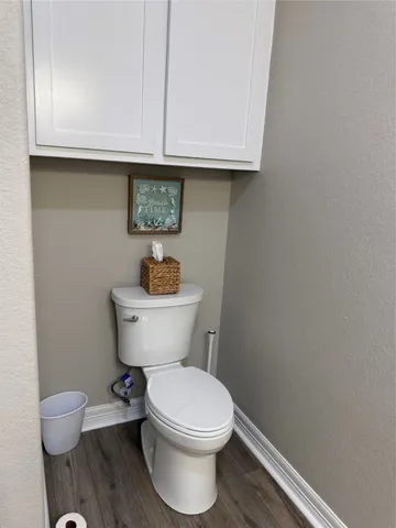 a bathroom with a toilet and a sink