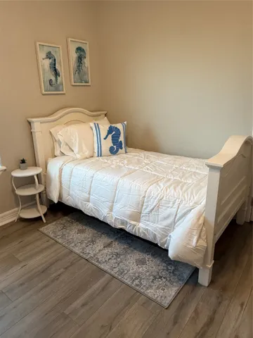 a bedroom with a bed and a couch