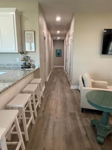 a view of a livingroom with furniture and wooden floor