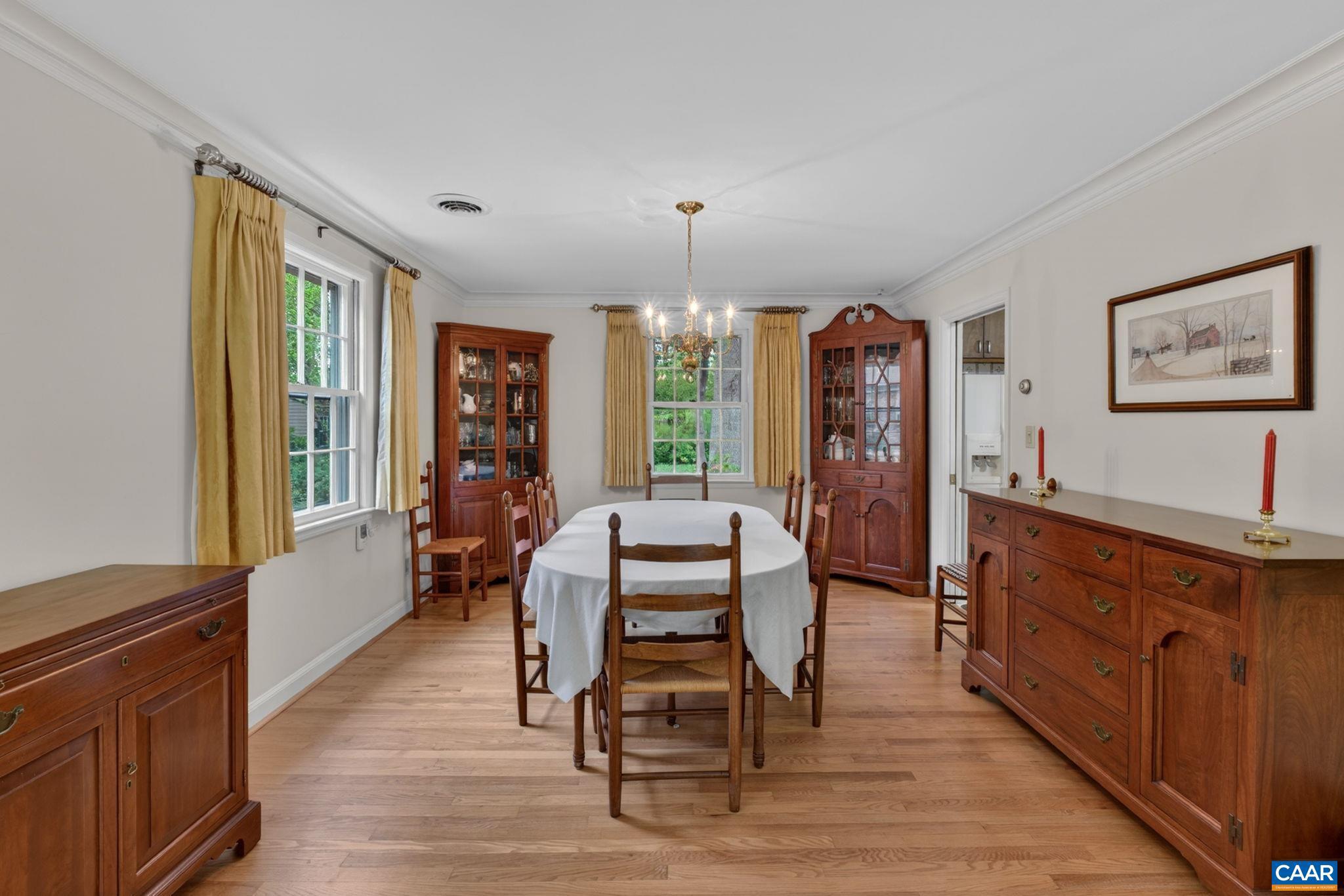 2409 Kerry Lane Charlottesville, VA 22901 - Photo 33 of 54 a dining room with wooden floor and furniture