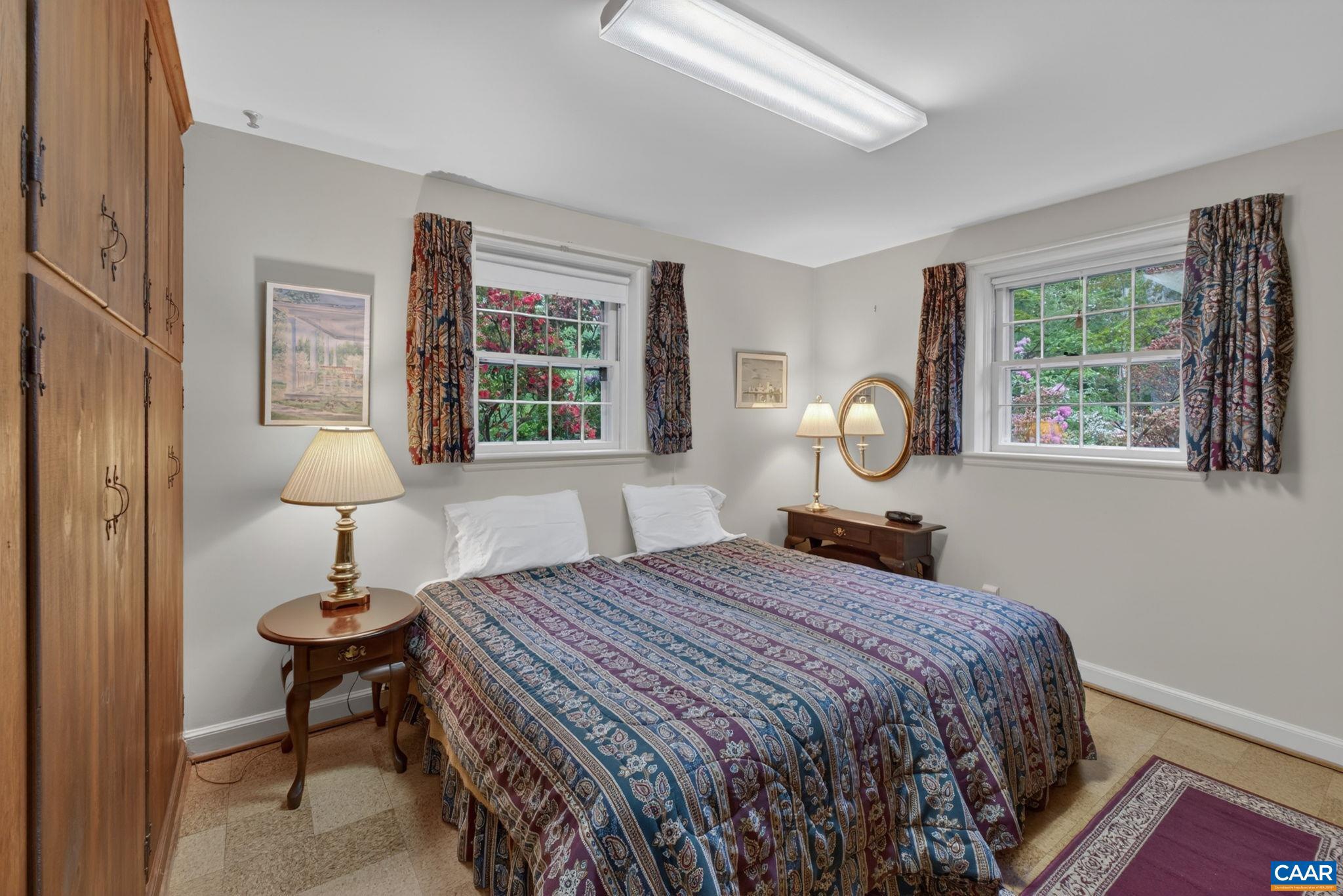 2409 Kerry Lane Charlottesville, VA 22901 - Photo 44 of 54 a bedroom with a bed and a table