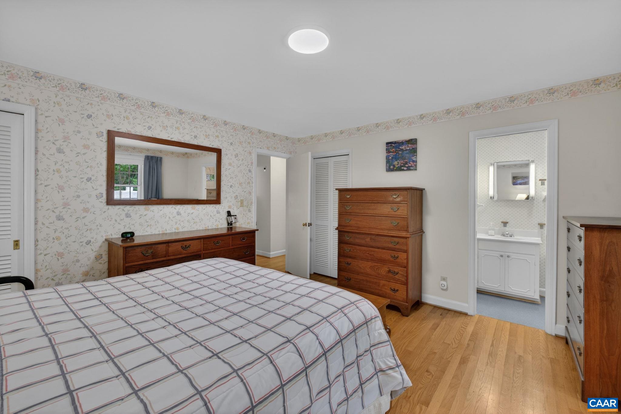 2409 Kerry Lane Charlottesville, VA 22901 - Photo 51 of 54 a bedroom with a bed and a dresser