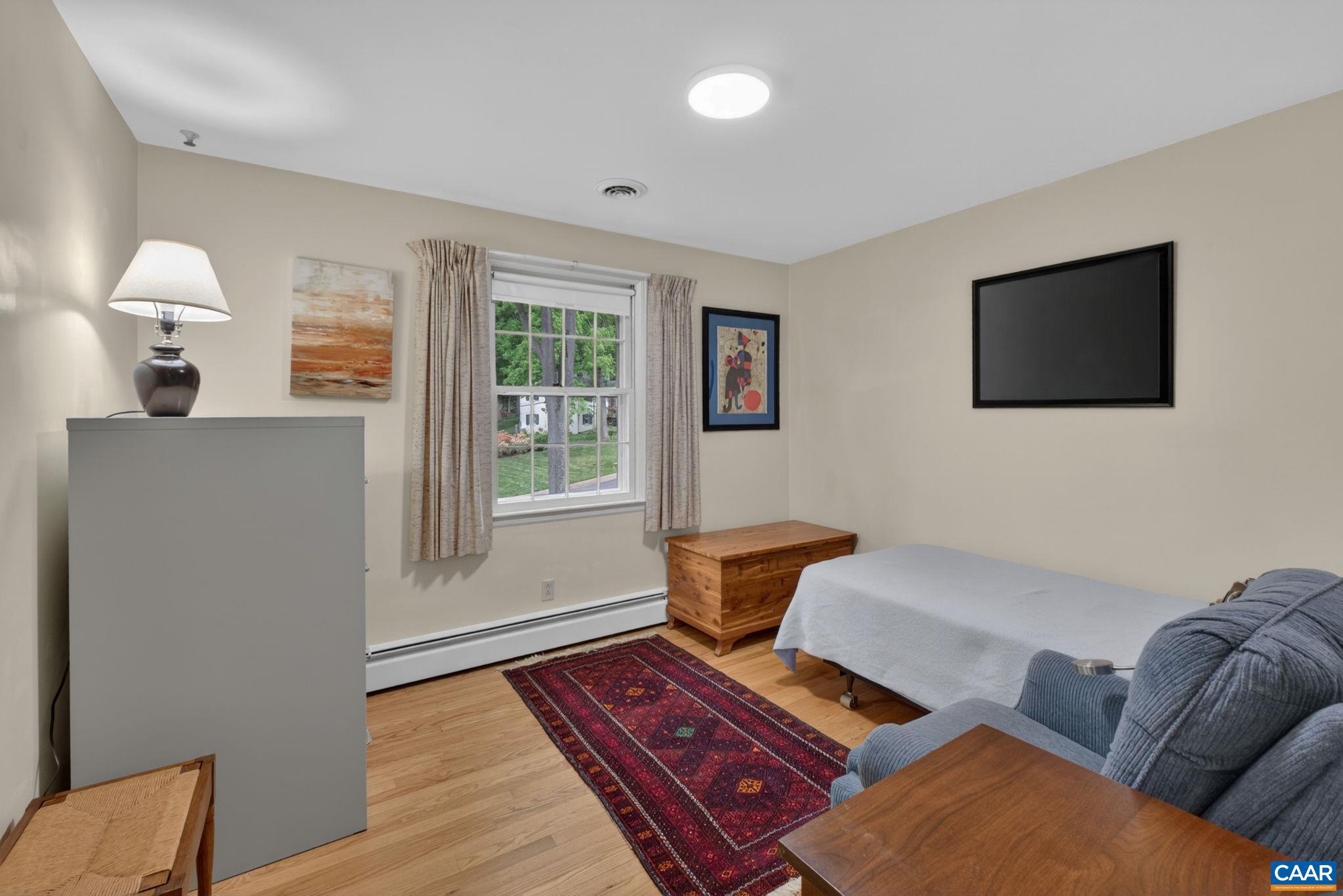 2409 Kerry Lane Charlottesville, VA 22901 - Photo 54 of 54 a living room with furniture a flat screen tv and wooden floor