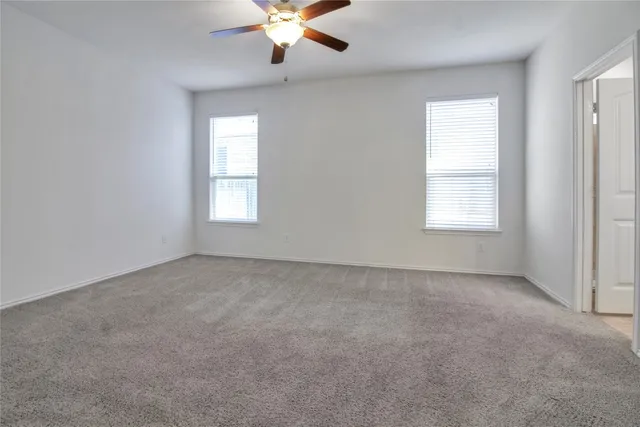 a kitchen with kitchen island granite countertop stainless steel appliances cabinets a sink and a counter space