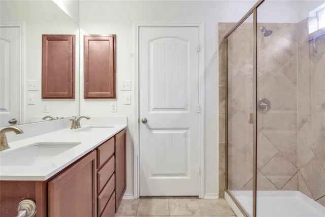 a bathroom with 2 sink and a mirror