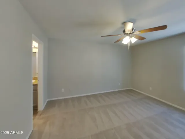a kitchen with kitchen island granite countertop a stove and a refrigerator