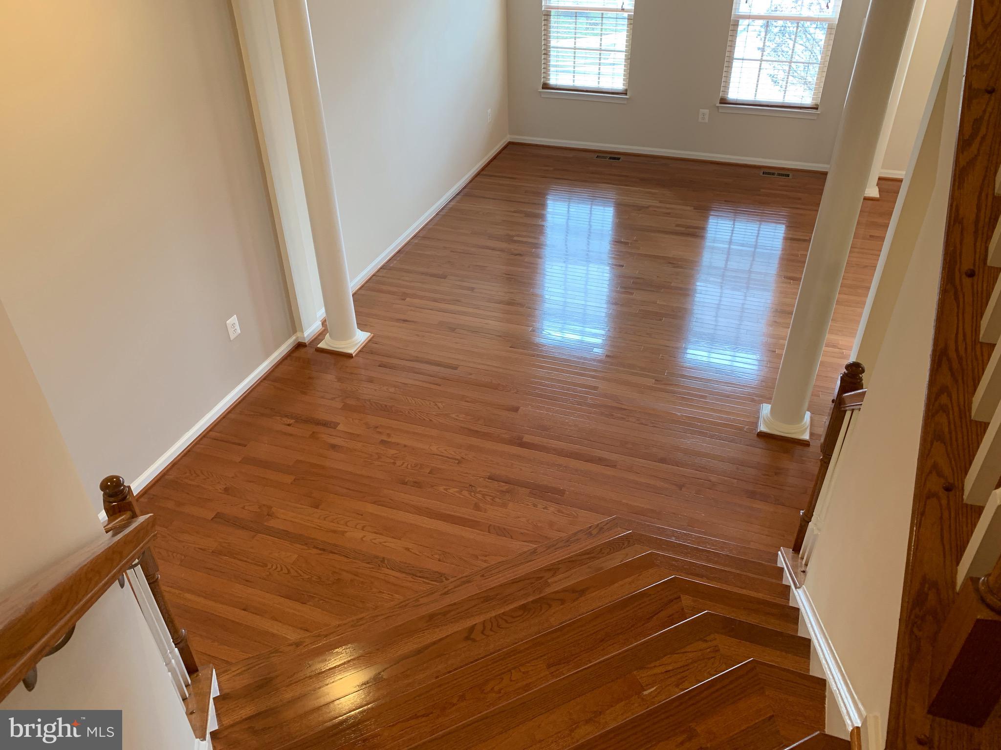 2816 Admiral Ridge Road Accokeek, MD 20607 - Photo 23 of 38 a view of a hallway with wooden floor and staircase