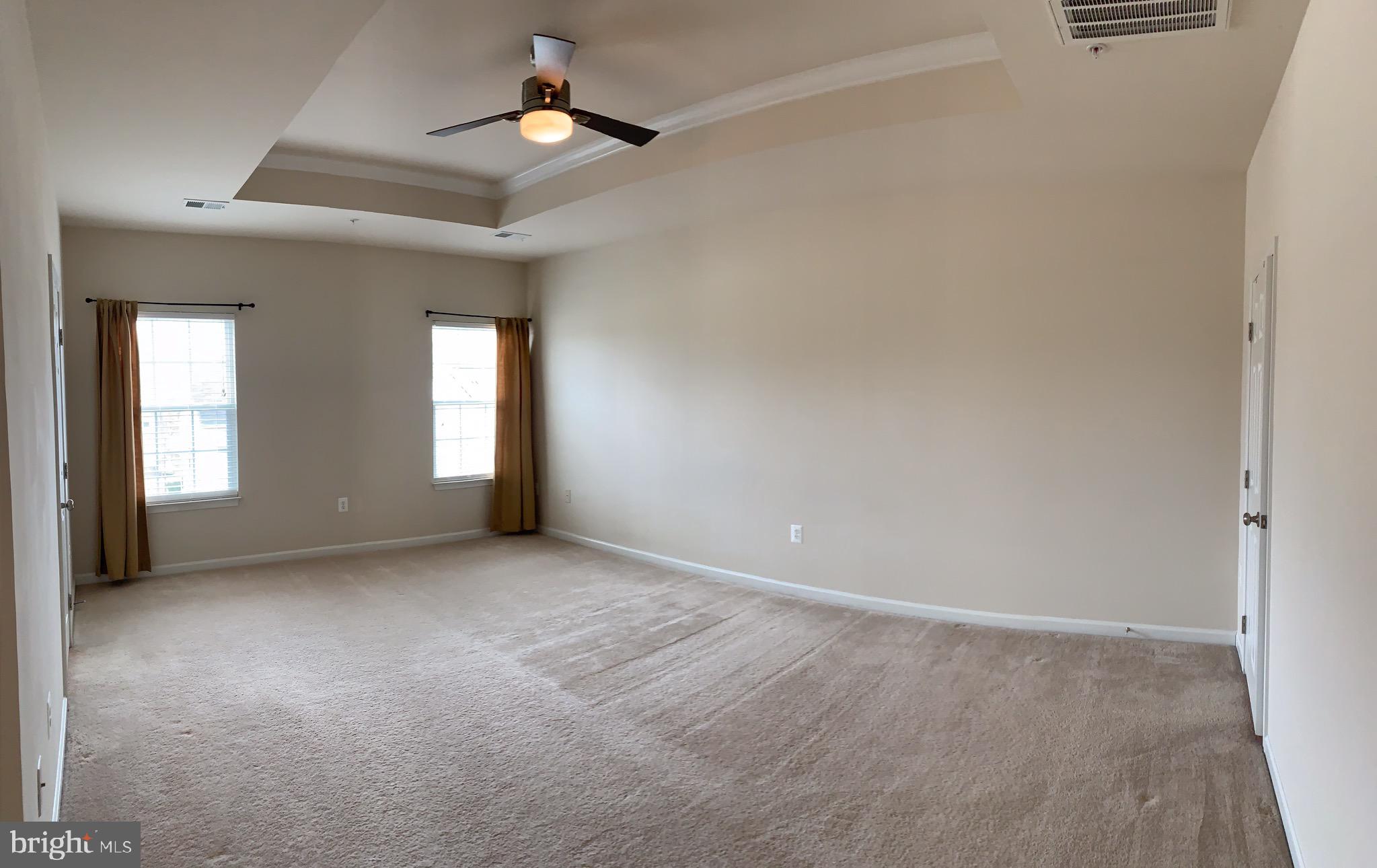 2816 Admiral Ridge Road Accokeek, MD 20607 - Photo 28 of 38 an empty room with windows and fan