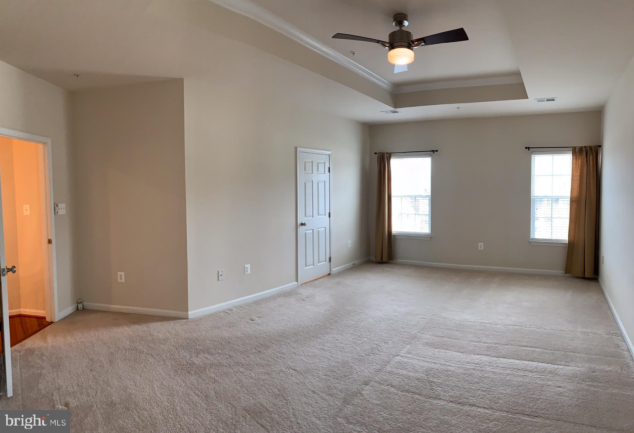 2816 Admiral Ridge Road Accokeek, MD 20607 - Photo 29 of 38 an empty room that has a window and kitchen view