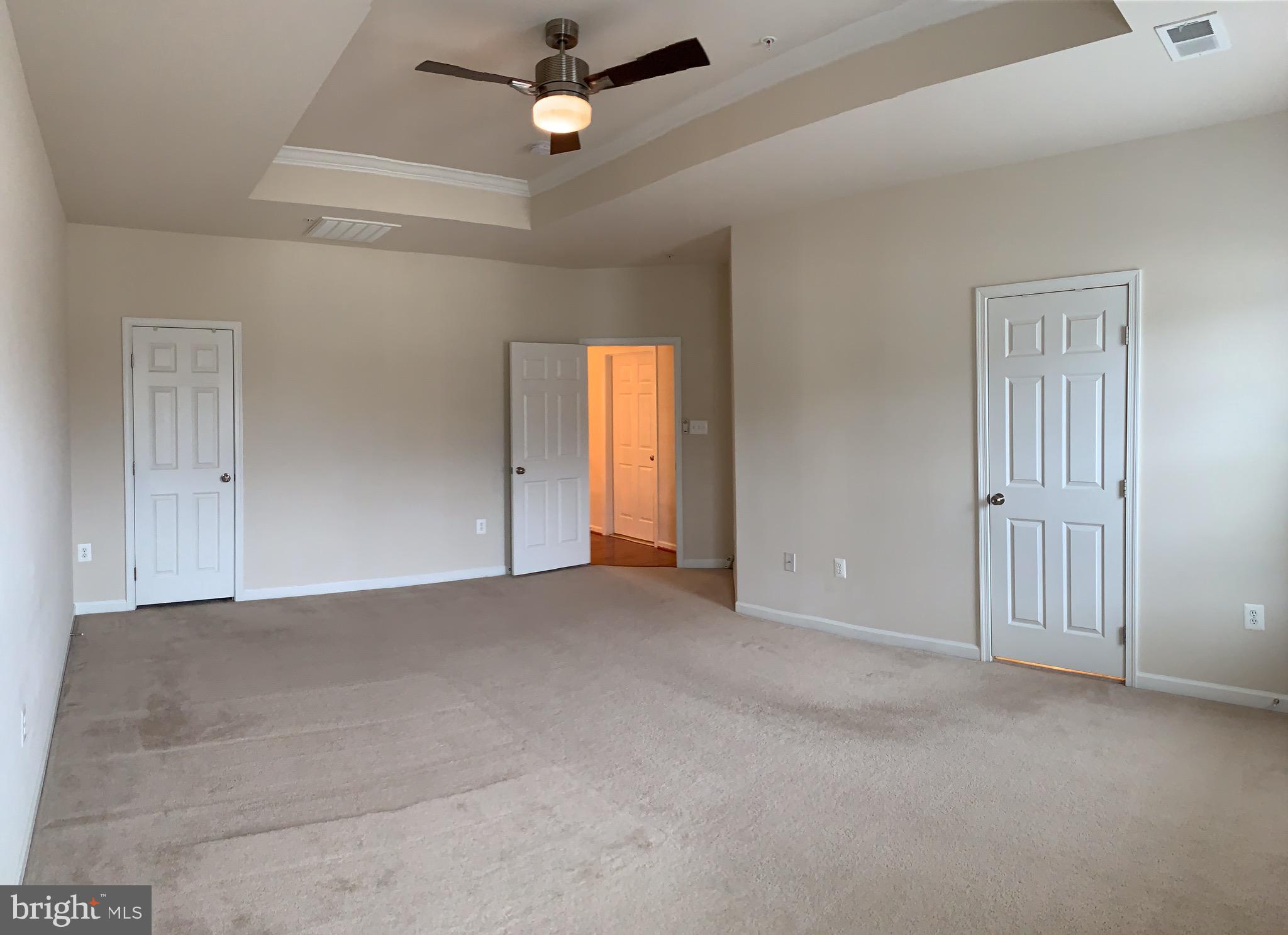 2816 Admiral Ridge Road Accokeek, MD 20607 - Photo 30 of 38 an empty room with windows and fan