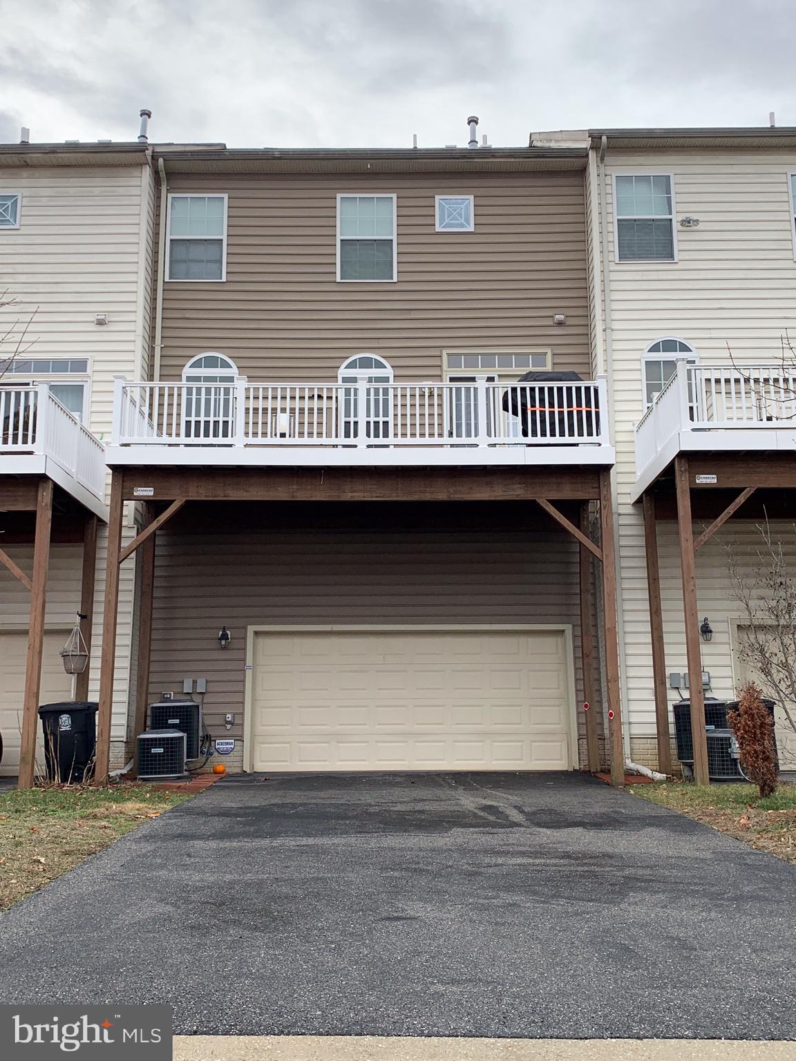 2816 Admiral Ridge Road Accokeek, MD 20607 - Photo 35 of 38 a view of a brick house with many windows
