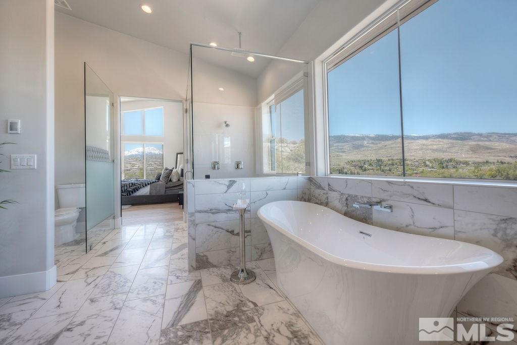 2372 Diamond J Place Reno, NV 89511 - Photo 14 of 25 a bathroom with a bathtub and a sink