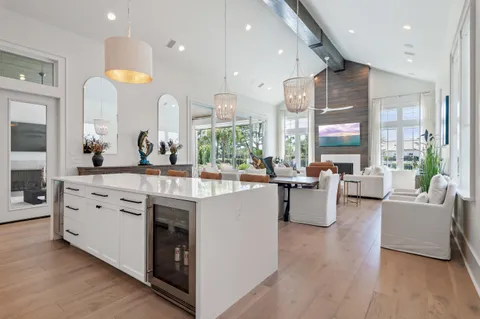 a bathroom with a granite countertop sink mirror and bathtub