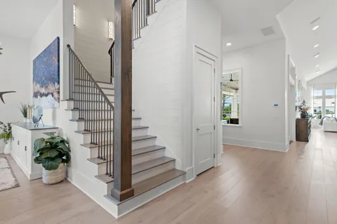 a bathroom with a shower sink and mirror