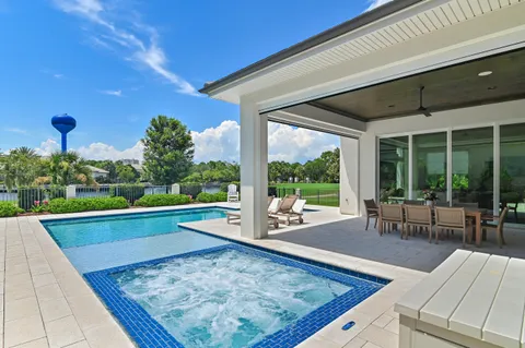 a view of a swimming pool with a yard