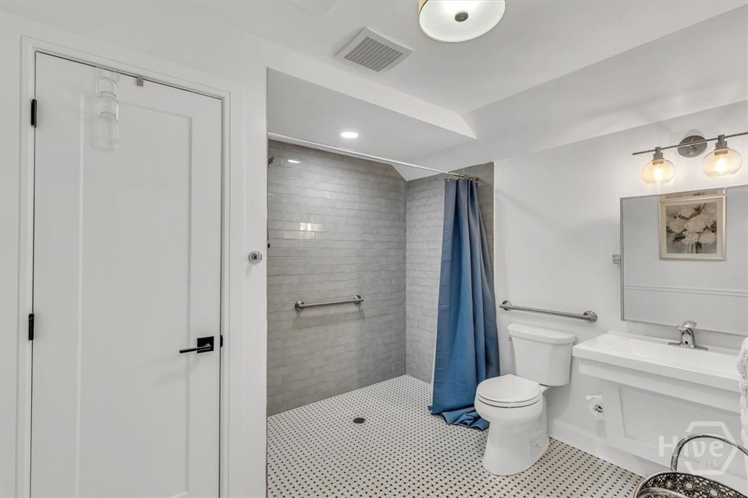 822 Dancy Avenue Savannah, GA 31419 - Photo 64 of 74 No threshold to shower- perfectly wheelchair accessible.