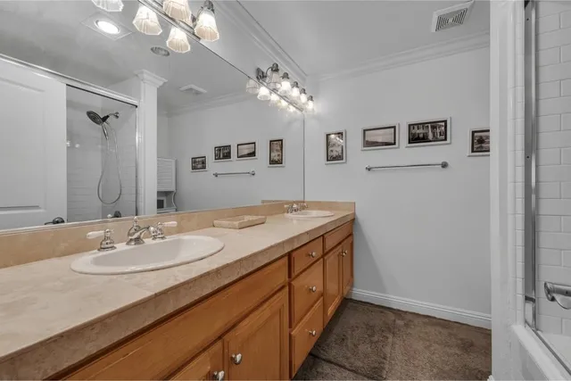 a bathroom with a sink double vanity and a mirror
